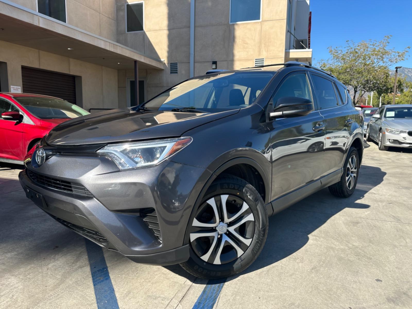 2016 Gray /Black Toyota RAV4 (JTMZFREVXGJ) , AUTOMATIC transmission, located at 30 S. Berkeley Avenue, Pasadena, CA, 91107, (626) 248-7567, 34.145447, -118.109398 - Crown City Motors is a used “Buy Here Pay Here” car dealer in Pasadena CA. “Buy Here Pay Here” financing, means that when you purchase your vehicle from our dealership, that you make the payments to the dealership as well. We do not need the banks approval to get you approved for a used auto - Photo #8